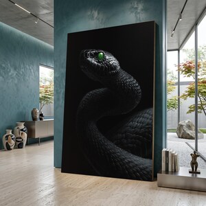May include: A large canvas print featuring a detailed image of a black snake with bright green eyes. The snake is coiled against a black background, creating a striking contrast. The artwork is displayed in a modern interior setting.