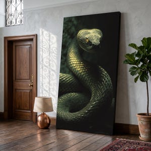 May include: A large canvas print depicting a green snake with yellow eyes. The snake is coiled, with its head in focus. The artwork has a dark background, accentuating the snake's scales and form. The print is displayed indoors.