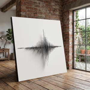 May include: A large, square canvas print featuring a black and white sound wave design. The artwork is displayed in a room with a brick wall, wooden floor, and a large window with natural light.