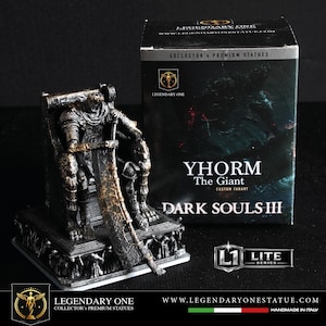 May include: A white ceramic mug with a black handle and the text "But First, Coffee" in a bold, black font. The mug is sitting on a wooden surface. The mug is approximately 4 inches tall.