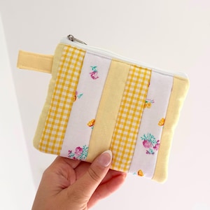 Small quilted yellow patchwork pouch