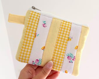 Small quilted yellow patchwork pouch