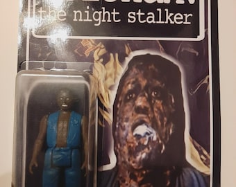 May include: A vintage action figure of a character from "Kolchak: The Night Stalker" in its original packaging. The figure is wearing a blue vest and pants. The packaging features the show's title and a zombie image.