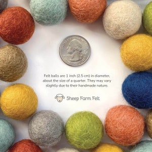May include: A close-up of a variety of felt balls in different colors, including yellow, orange, blue, green, and beige. The balls are about 1 inch in diameter, the size of a US quarter. The text "Felt balls are 1 inch (2.5 cm) in diameter, about the size of a quarter. They may vary slightly due to their handmade nature. Sheep Farm Felt" is written below the balls.
