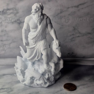 May include: A white statue of a bearded man in classical attire, holding a goat. The sculpture stands on a textured base, possibly representing a mythological scene. A penny is in the foreground.