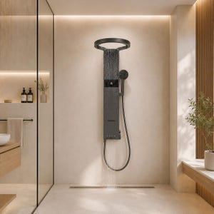 May include: A matte black shower panel system mounted on a wall, featuring a circular overhead rainfall shower head, a digital temperature display, a handheld shower wand with a flexible hose, and integrated body spray nozzles emitting water.
