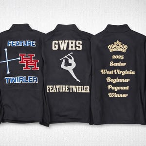 May include: Four black athletic jackets with various designs. One jacket says "Auxiliary Captain" with flags and a logo. Another says "Feature Twirler" with batons and a logo. A third says "GWHS Feature Twirler". The last jacket has a crown and text.