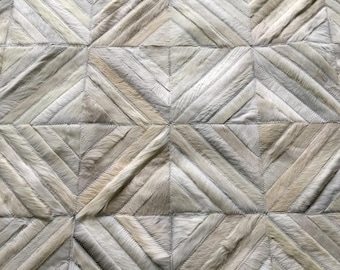 Handmade Cowhide Patchwork Rug: Barrio Norte Design