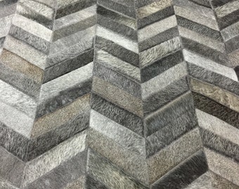Handmade Charcoal Gray Cowhide Rug: Chevron Patchwork Design