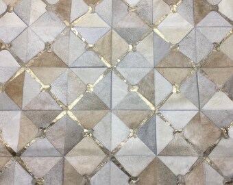 Handmade Cowhide Patchwork Rug: Cream, Grey, and Metallic Gold