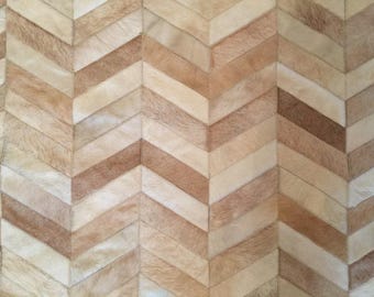 Handmade Cowhide Rug: Beige Chevron Patchwork Design