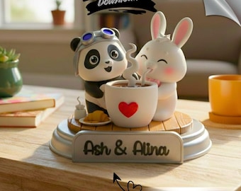 Puede incluir: Figura decorativa con un panda con gafas y un conejo blanco, compartiendo una taza de café con un corazón rojo. La base incluye los nombres "Ash & Alina" y el texto "GET CUSTOM NAME". También incluye el texto "DIGITAL DOWNLOAD".