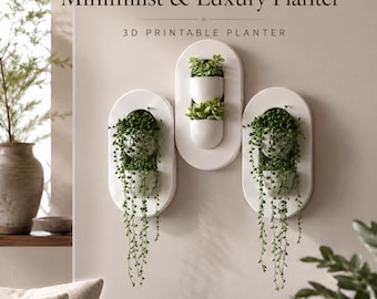 Puede incluir: Tres maceteros de pared ovalados blancos con el texto Minimalist & Luxury Planter y 3D PRINTABLE PLANTER. Cada macetero contiene suculentas verdes colgantes y pequeñas plantas en maceta, creando una exhibición vertical en la pared.