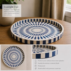 May include: A round decorative tray featuring a radial pattern of alternating dark blue and off-white diamond shapes. The tray has a raised edge with a vertical striped design in the same blue and white color scheme, creating a consistent look.