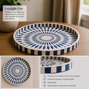 May include: A round decorative tray featuring a radial pattern of alternating dark blue and off-white diamond shapes. The tray has a raised edge with a vertical striped design in the same blue and white color scheme, creating a consistent look.