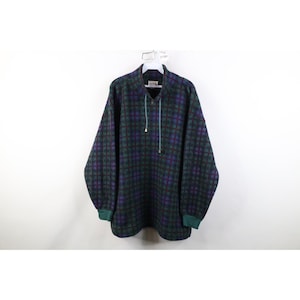 May include: A white ceramic mug with a black handle and the text "But First, Coffee" in a bold, black font. The mug is set against a blurred background, suggesting a cozy setting. The mug appears to be approximately 4 inches tall.