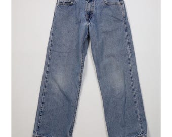 Jeans Levi's 569 para niño, estilo vintage Y2K 2001, talla 10, 25x25, de mezclilla desgastada, corte holgado y pierna ancha. Jeans Levi's 569 vintage para niño.