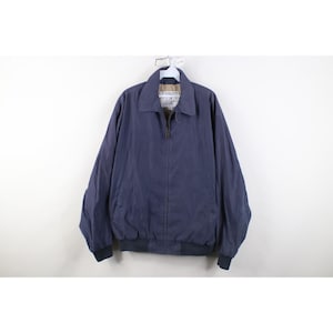 May include: A set of three ceramic mugs with a speckled, matte finish. The mugs are in shades of cream, light gray, and dark gray. Each mug has a simple, minimalist design and a rounded handle. The mugs are suitable for coffee, tea, or other beverages.