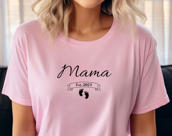 May include: Pink t-shirt with the text "Mama Est. 2024" and a pair of baby footprints.