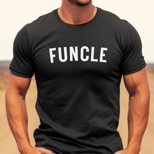 May include: A black t-shirt with the word "FUNCLE" printed in white on the front.