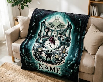 May include: A soft fleece throw blanket featuring a dark, teal-toned graphic illustration of characters from the video game Hollow Knight, including the Knight and Hornet, with the word NAME printed in a bold, stylized font at the bottom center.
