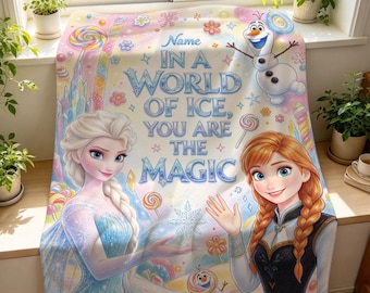 May include: A soft fleece blanket featuring Elsa and Anna from Frozen, with Olaf, colorful lollipops, and snowflakes. The text reads: Name IN A WORLD OF ICE, YOU ARE THE MAGIC. The design includes pastel colors, an ice castle, and floral accents.