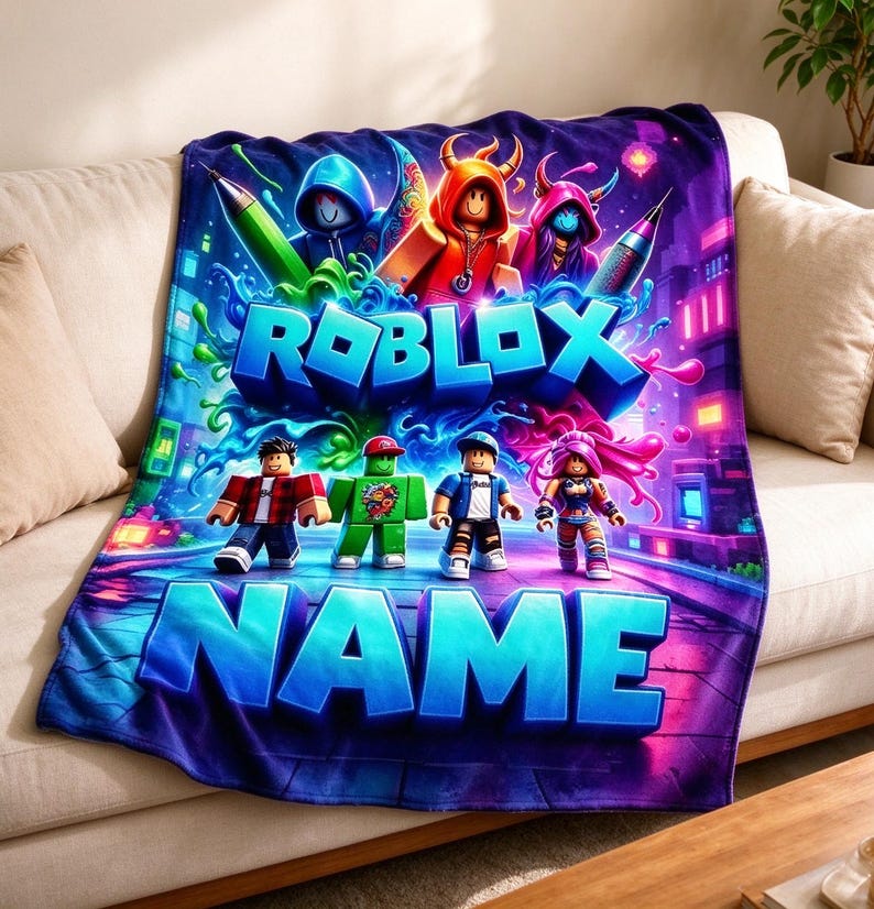 May include: A plush throw blanket featuring a vibrant Roblox graphic with characters, colorful paint splashes, and the text ROBLOX NAME in bold blue letters. The design includes a neon-colored city background with purple and blue tones.