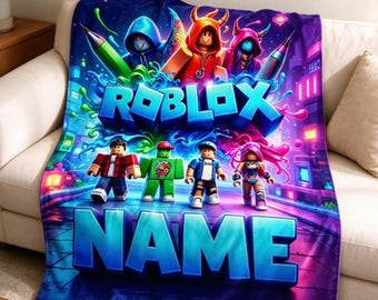 May include: A rectangular fleece blanket featuring a vibrant Roblox graphic with multiple block-style characters, neon blue and purple city background elements, and the text ROBLOX and NAME in large, bold, three-dimensional blue lettering.