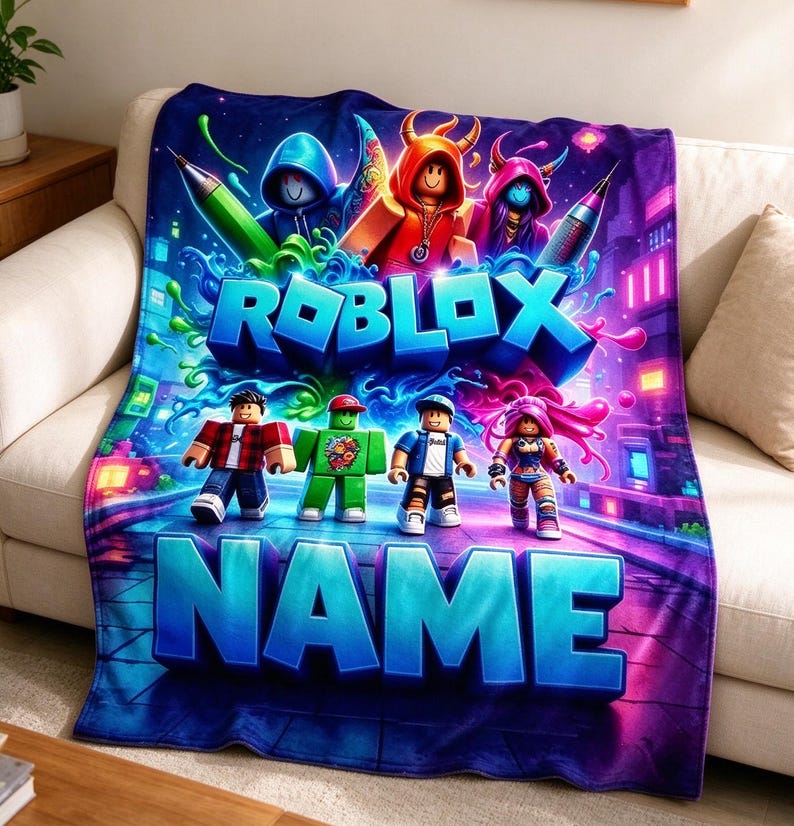 May include: A rectangular fleece blanket featuring a vibrant Roblox graphic with multiple block-style characters, neon blue and purple city background elements, and the text ROBLOX and NAME in large, bold, three-dimensional blue lettering.