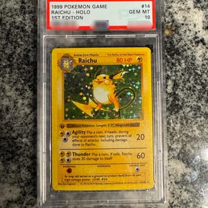 May include: A set of three ceramic mugs with a speckled, matte finish. The mugs are in shades of cream, light gray, and dark gray. Each mug has a simple, minimalist design and a rounded handle. The mugs are suitable for coffee, tea, or other beverages.