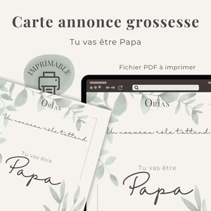 May include: A digital pregnancy announcement card with the text "Tu vas être Papa" (You're going to be a Dad) in elegant script. The design includes watercolor-style leaves and the word "Imprimable" (Printable). A tablet displays the card.