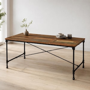May include: A rectangular dining table with a multi-colored, reclaimed wood top and black metal legs. The table is 72 inches long and 36 inches wide. A small vase with greenery and a set of dishes are on the table.