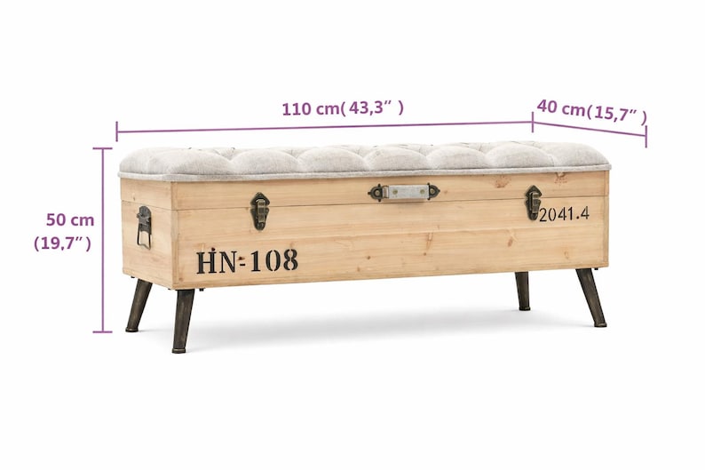 May include: A wooden storage bench with a tufted, light gray upholstered top. The bench is 43.3 inches long, 15.7 inches wide, and 19.7 inches high. It features metal hardware, black legs, and the text "HN=108" and "2041.4" printed on the front.