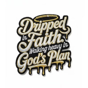 May include: Embroidered patch with the words "Dripped in Faith" in a stylized font, with "Walking heavy in God's Plan" below. The patch is black with white and gold accents, including a gold halo.