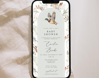 May include: A smartphone displaying a digital baby shower invitation with a mallard duck illustration, botanical foliage, and an arched frame. The text reads: Please join us for a baby shower honoring Emilia Brooks, Saturday, December 17, 2022, 2:00 PM.