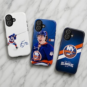 May include: Three phone cases featuring New York Islanders hockey designs. One white case shows a player with number 13 and a signature. One blue case features a player with number 48. One blue case displays the team logo and text New York Islanders.