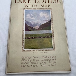 May include: A vintage guide to Lake Louise, Alberta, Canada, with a photo of the lake and mountains. The guide includes information on carriage drives, walking and climbing trips, camping, saddle horse trips, tariffs, and general information.