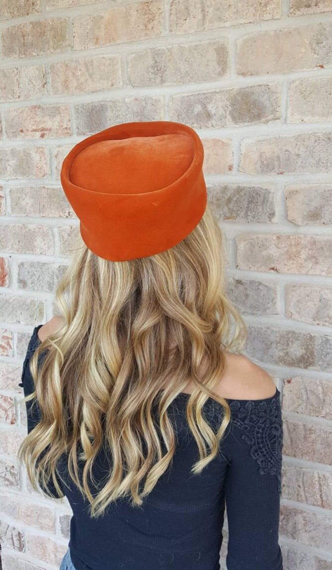 orange hats and fascinators