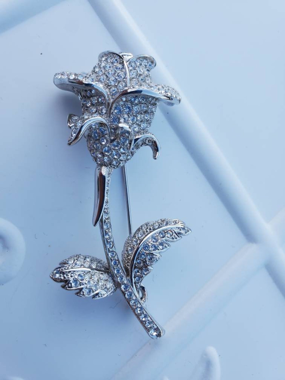 nolan miller rose brooch