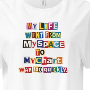 May include: White crop top with the text "MY LIFE WENT FROM MySPACE TO MyChart WAY TOO QUICKLY" in colorful block letters. The shirt has a crew neck and short sleeves.
