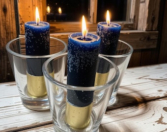 Shotgun shell candles in a shot glass. 12g. Candles with refills. Brass or nickle base candles. Shot shell candle sticks. Bullet candles.
