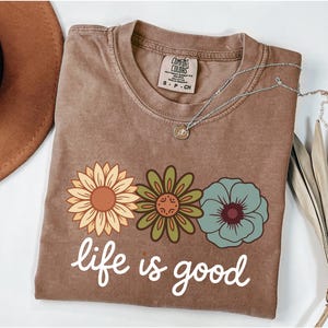 May include: A rustic wooden sign with the text "Welcome to our home" in a handwritten style. The sign features a distressed finish and a simple, inviting design, perfect for a front porch or entryway.