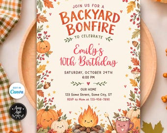 May include: A rectangular invitation card for a backyard bonfire birthday party. The cream-colored card features orange and red autumn leaves, pumpkins, a campfire, and a mug of cocoa. Text reads: JOIN US FOR A BACKYARD BONFIRE TO CELEBRATE Emily's 10th Birthday.