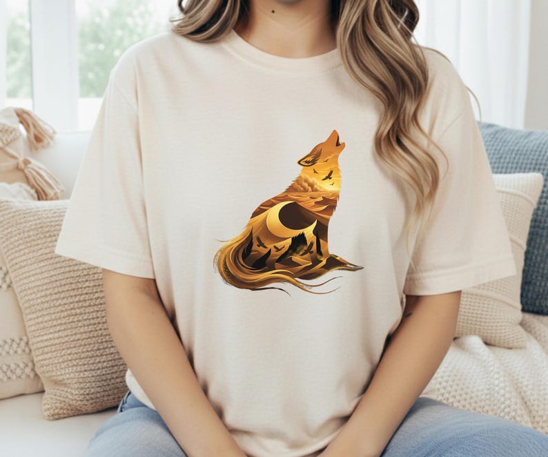 A woman in a cream-colored t-shirt that complements the warm earth tones and sun-drenched aesthetic of the desert wolf design.