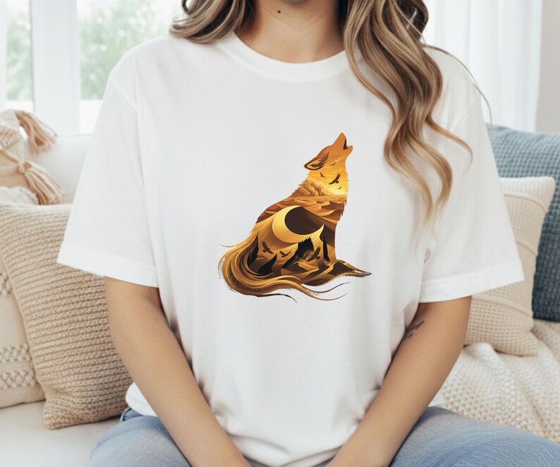 A woman in a white t-shirt where the vibrant golden and burnt sienna colors of the desert design stand out with maximum clarity.