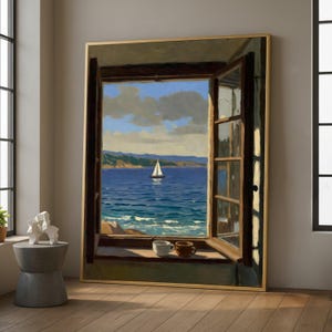 May include: A framed painting depicts a coastal scene viewed through an open window. The artwork showcases a sailboat on blue water under a cloudy sky. Two coffee cups sit on the windowsill. The frame is gold.