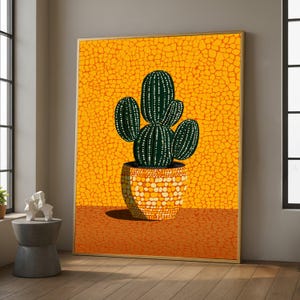 May include: A framed art print depicting a cactus in a patterned pot. The cactus is dark green with white dots and vertical lines. The background is a textured yellow, and the pot is orange with white spots.