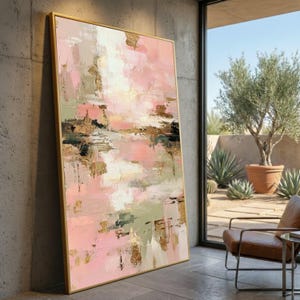 May include: A white ceramic mug with a black handle and the text "But First, Coffee" in a black, bold font. The mug is sitting on a wooden surface. The mug is approximately 4 inches tall.