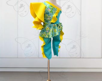 Unique teal with floral and highlights of yellow one shoulder flounce sleeve with matching capris with yellow flounces