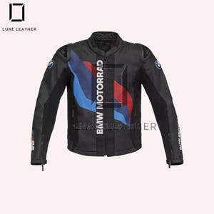 May include: Black motorcycle jacket with blue, red, and white detailing. The jacket has the text "BMW MOTORRAD" down the front and "LUXE LEATHER" at the top and bottom. The BMW logo is on the sleeves.